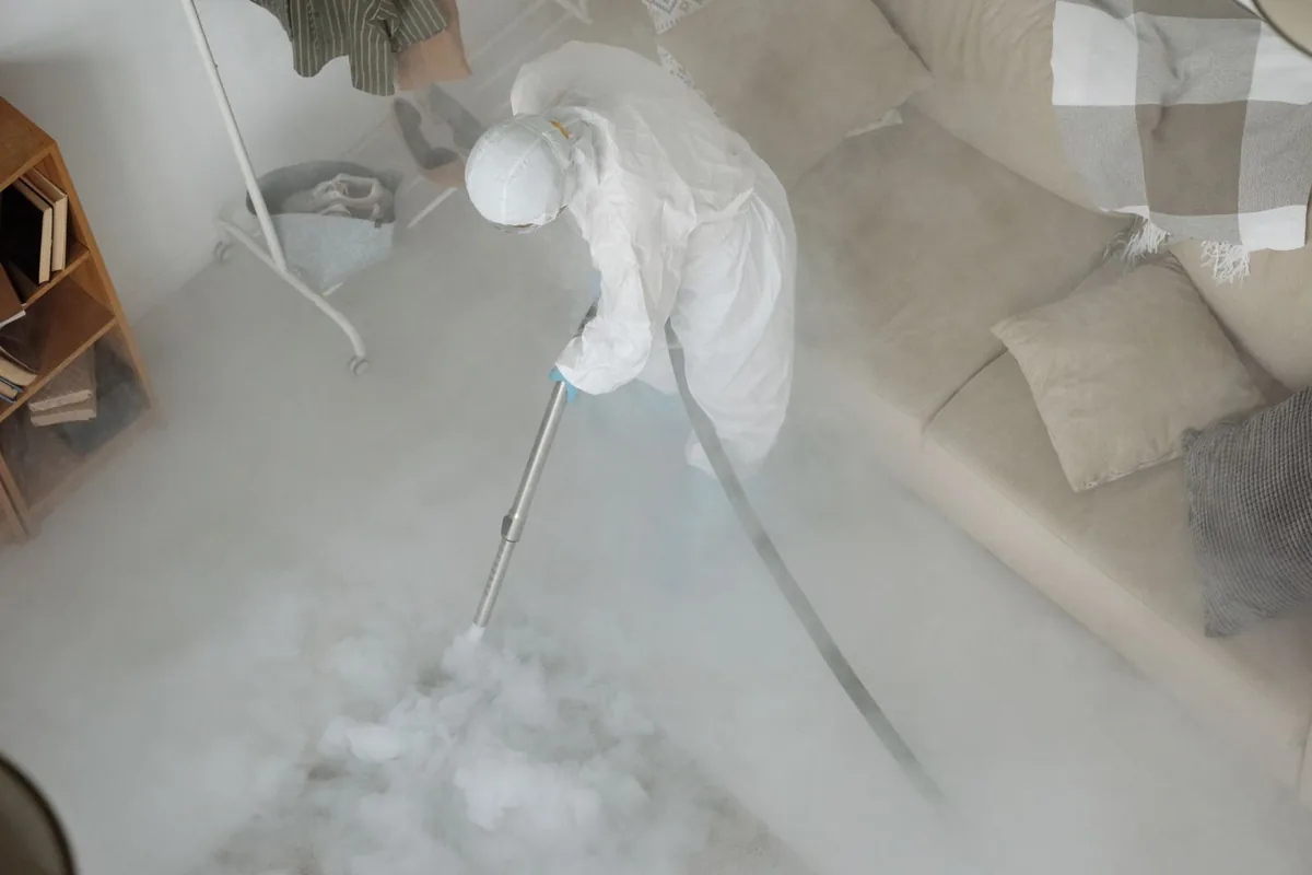 Biohazard cleanup technician in protective equipment, Townsend, MT